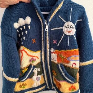Colorful hand knitted Alpaca with Sun and Cloud Design